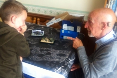 Paul Bennett explains scale model progress to Brixham primary schoolpupil.