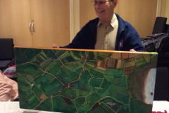 Project artist Dave Brumwell with his Victorian  'Cowtown Parish' map painting.