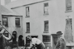 Working on the 'Town Shute' water pump. St Mary's Square.