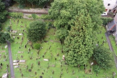 View from top of church tower down to grave yard.
