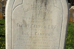 Clear view of inscriptions on stone memorial headstone.