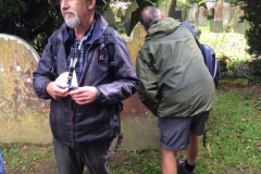 Ecologist Nigel Wood recording lichen growth on grave stones.